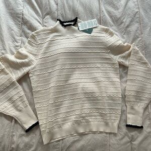 Cream Sweater with Black Trim